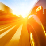 A car driving on a motorway at high speeds, overtaking other cars