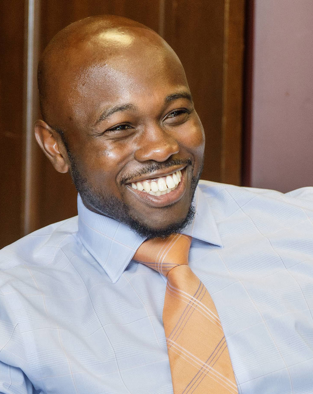 Publicity image of Alex Marshall in the conference room at DeMent Askew Johnson & Marshall, downtown Raleigh.